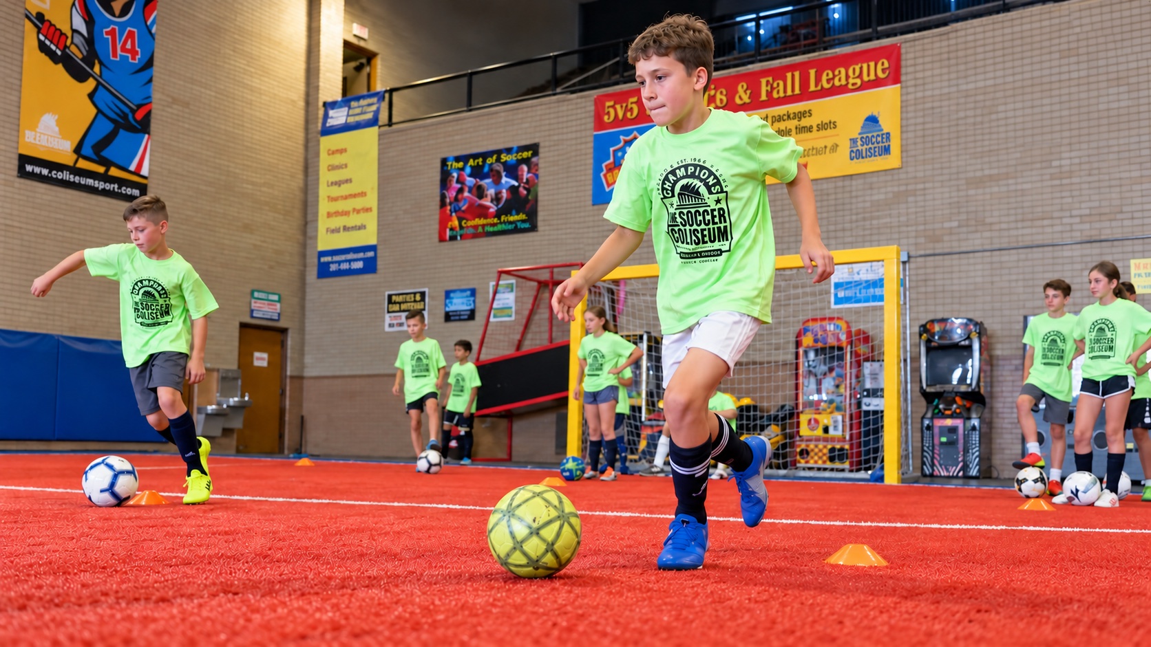 Youth players dribbling through cones on the red turf at The Soccer Coliseum